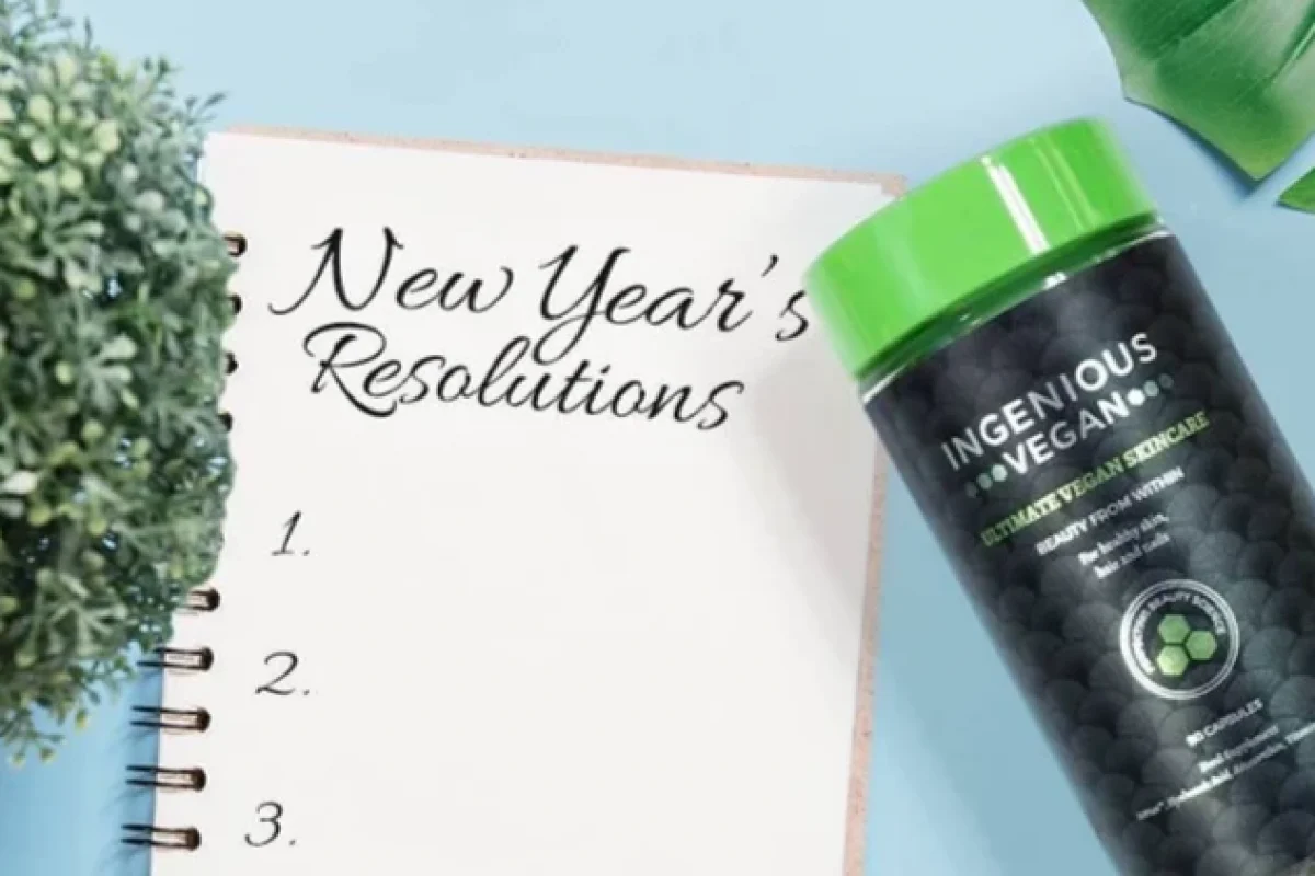 A tub of INGENIOUS Vegan collagen capsules next to a notepad which reads 'New Year's Resolutions'